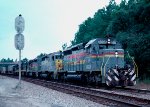 Louisville & Nashville SD40-2 #8028, leading Seaboard Coast Line train #320 is at track speed, with a friendly wave from the engineer 